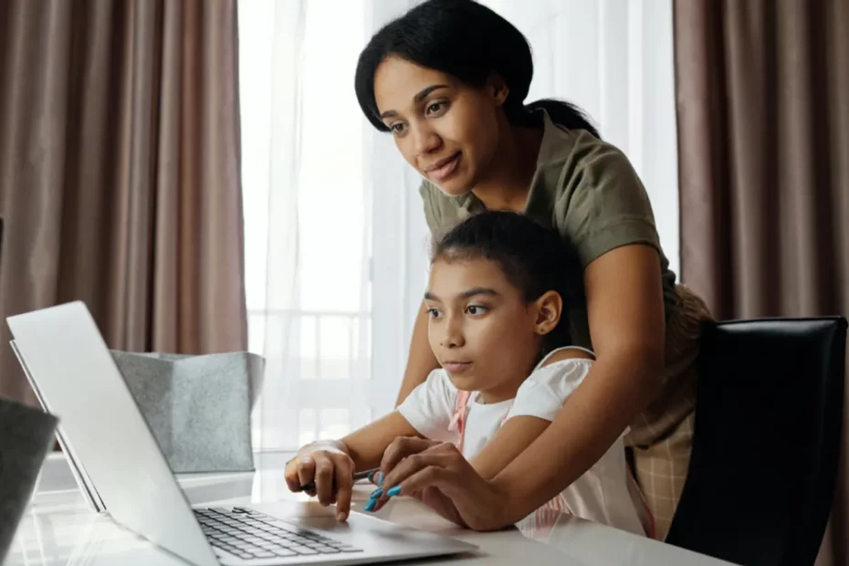 mother and child using laptop