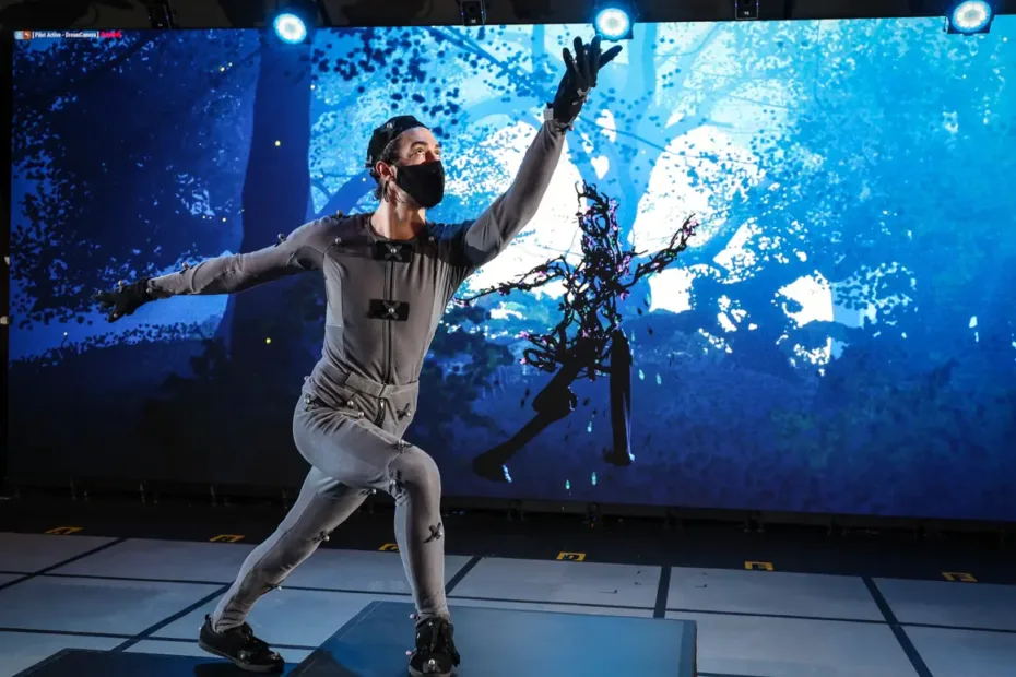 person in grey body suit moving past stage set of forest