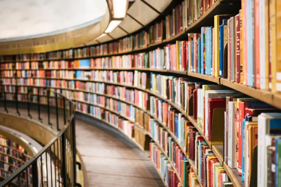 library book shelves curving round a mezzanine floor