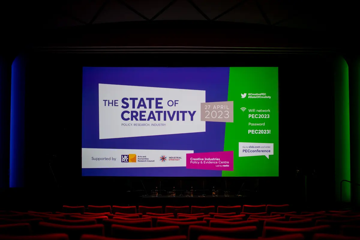 cinema with screenn showing graphic for State of creativity conference 2023