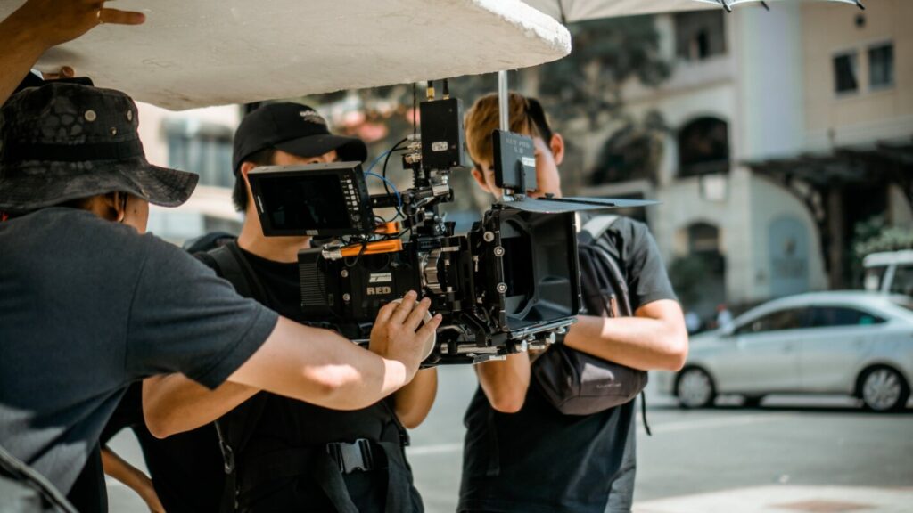 film crew filming in busy street