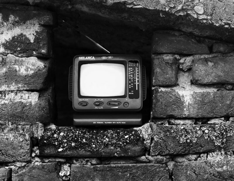 picture of old portable TV sat in gap in stone wall - courtesy of Shubham Verma