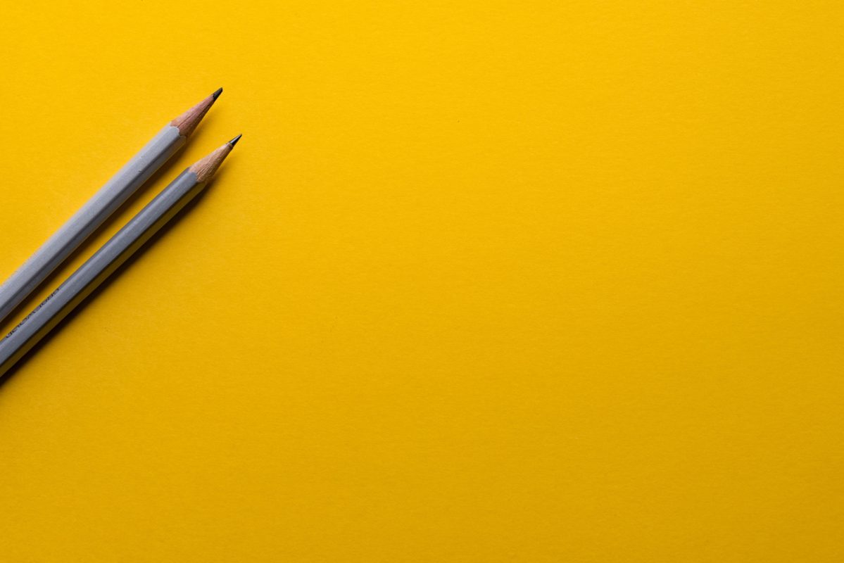 image of two pencils on yellow background - courtesy of Joanna Kosinska
