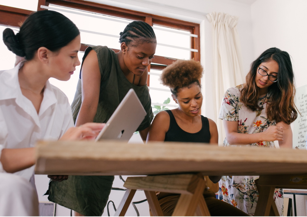 People working collaboratively at a desk