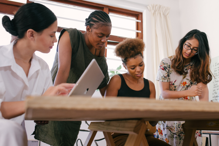 People working collaboratively at a desk