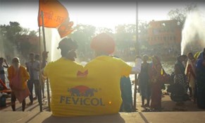 Two people in one large yellow t-shirt